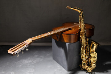 Acoustic guitar and saxophone in studio. Music concept with musical instrument