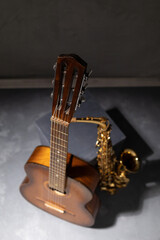 Acoustic guitar and saxophone in studio. Music concept with musical instrument