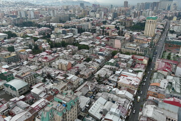 Fototapeta na wymiar Batumi city after snowfall, aerial view