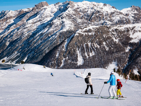 Skiers on a slope of Livigno