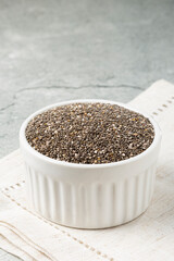 Chia seeds in bowl on the table.