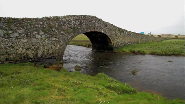 Old hump-backed bridge Pont Pont Aberffraw on Anglesey, Wales UK