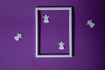Guardian angels of peace and harmony in a white frame on a purple background