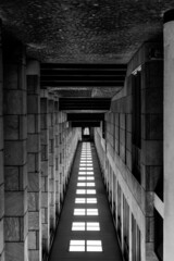 inverted stairway in a stone corridor with black and white photo style in Europe
