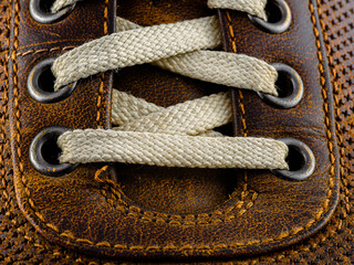 Closeup of interesting Shoe laces, detailed and distressed