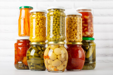 canned food on a white background, different types of canned vegetables