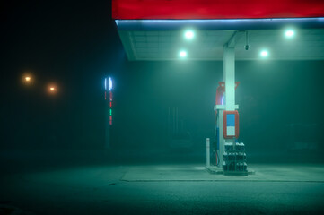 Empty Gas Station During a Foggy Night