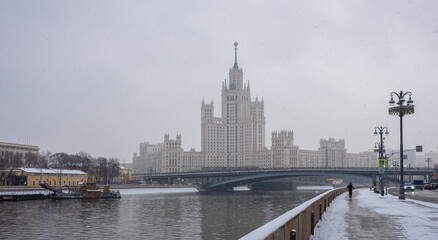 Fototapeta na wymiar December 5, 202, Moscow, Russia. View of the Stalinist skyscraper on Kotelnicheskaya embankment in Moscow in winter during a snowfall.