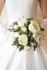 Bride and bouquet in white dress