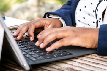 Latina woman's hands working in the park