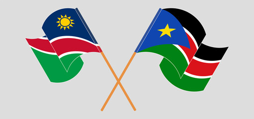 Crossed and waving flags of Namibia and South Sudan