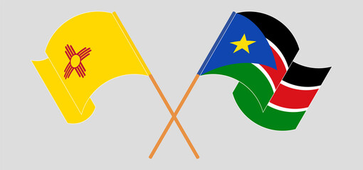 Crossed and waving flags of the State of New Mexico and South Sudan