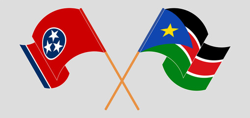 Crossed and waving flags of The State of Tennessee and South Sudan