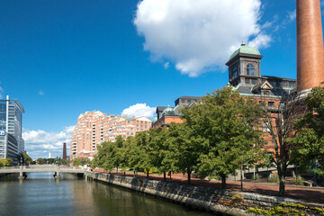 Baltimore East Harbor canal with modern high-rises and historic buildings. - obrazy, fototapety, plakaty