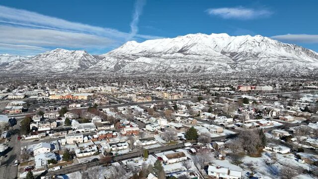Timpanogos peak covered in snow sitting above Orem Utah