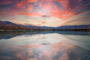 mountains landscape with lake in red sunset