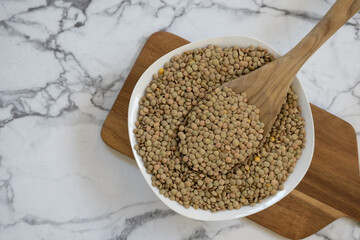 Top view of plate with raw lentils with copy space