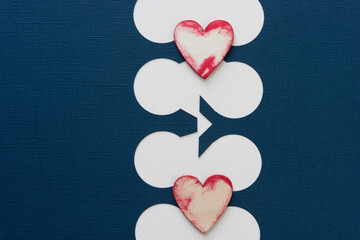 two stained hearts made of wood with fancy paper background with circles
