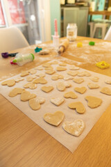 many heart cookies ready to bake for valentine's day, vertical photo