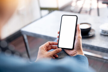 cell phone blank white screen mockup.hand holding texting using mobile on desk at office.background empty space for advertise.work people contact marketing business,technology