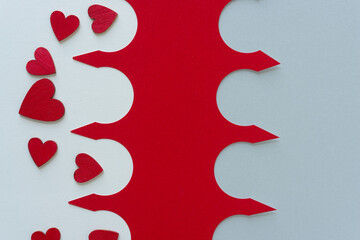 grungy wooden hearts painted red set against a fancy paper design