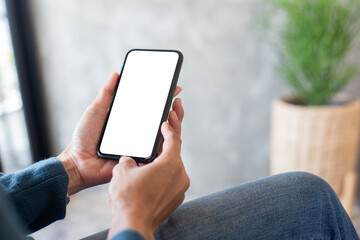cell phone blank white screen mockup.hand holding texting using mobile on desk at office.background empty space for advertise.work people contact marketing business,technology