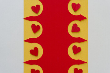 grungy wooden hearts painted red set against a fancy paper design