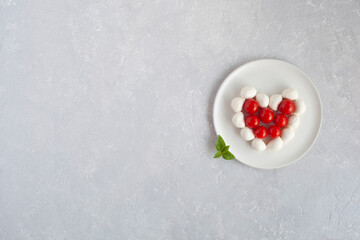 Tomatoes cherry and mozzarella, heart shape, Valentine Day concept