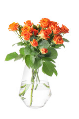 Vase with beautiful orange roses on white background
