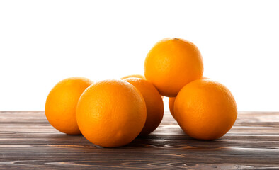 Fresh ripe oranges on wooden table against white background
