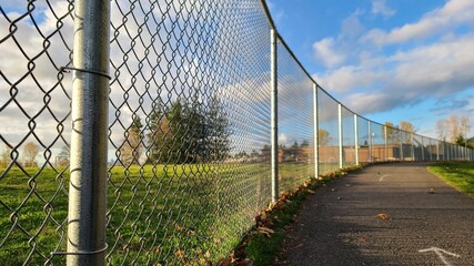 Fototapeta premium Fence with wire near school