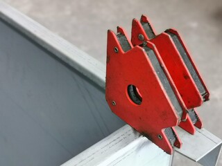 used magnetic welding holder on iron cabinet.