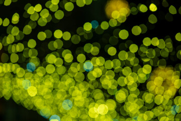 Holiday lights in out of focus. Christmas lights. Holiday background. Winter illuminations.