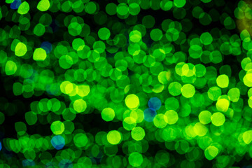 Holiday lights in out of focus. Christmas lights. Holiday background. Winter illuminations.