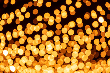 Holiday lights in out of focus. Christmas lights. Holiday background. Winter illuminations.