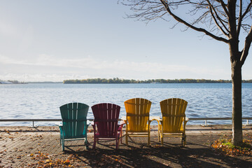 Colourful chairs by the lake