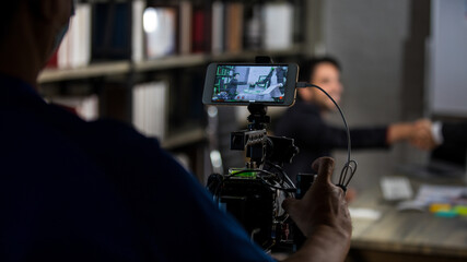 Millennial Indian Asian thoughtful professional successful executive bearded male businessman manager entrepreneur in formal suit sitting thinking deciding solution solving idea holding hand at chin