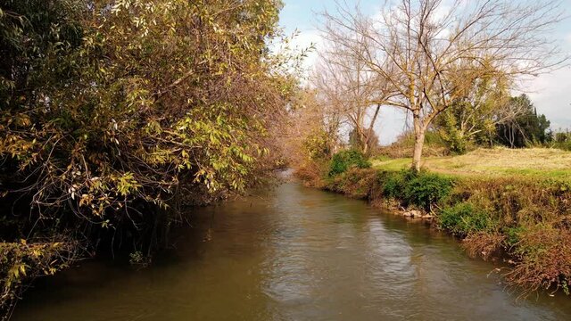 Water flows in a small waterfall in the lower Hermon River that flows in northern Israel the Golan Heights. In an area called Hanio Eucalyptus in the settlement of Sde Nehemia