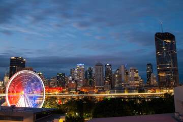 Brisbane southbank australia in evening with light and wheel,landmark city.
