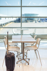 Empty seats and tables in an empty airport terminal 