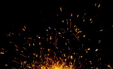 Sparks from firework in front of black backgound