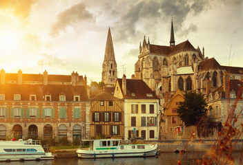 View of Auxerre cityscape with Saint-Germain Abbey on river Yonne on cloudy autumn day, Burgundy,...
