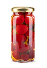 A glass jar with ripe preserved peppers is isolated on a white background. Full clipping path.