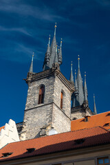 Fototapeta premium Travel to Czech Republic. Tyn Church spectacular building in Prague in a beautiful summer day, in the Old Town Square. Landmarks of Prague.