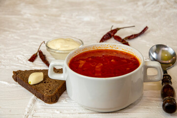 Ukrainian borsch. Traditional dish of Ukraine. Red borscht on a white plate.