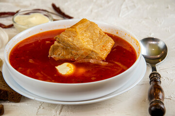 Ukrainian borsch. Traditional dish of Ukraine. Red borscht on a white plate.