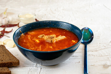 Ukrainian borsch. Traditional dish of Ukraine. Red borscht on a white plate.