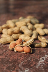 Bunch of fresh peeled peanuts on a tile