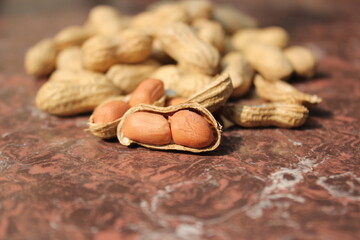 Bunch of fresh peeled peanuts on a tile