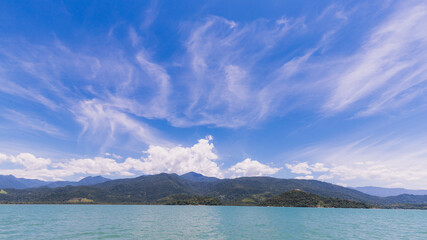 Green mountain under blue sky